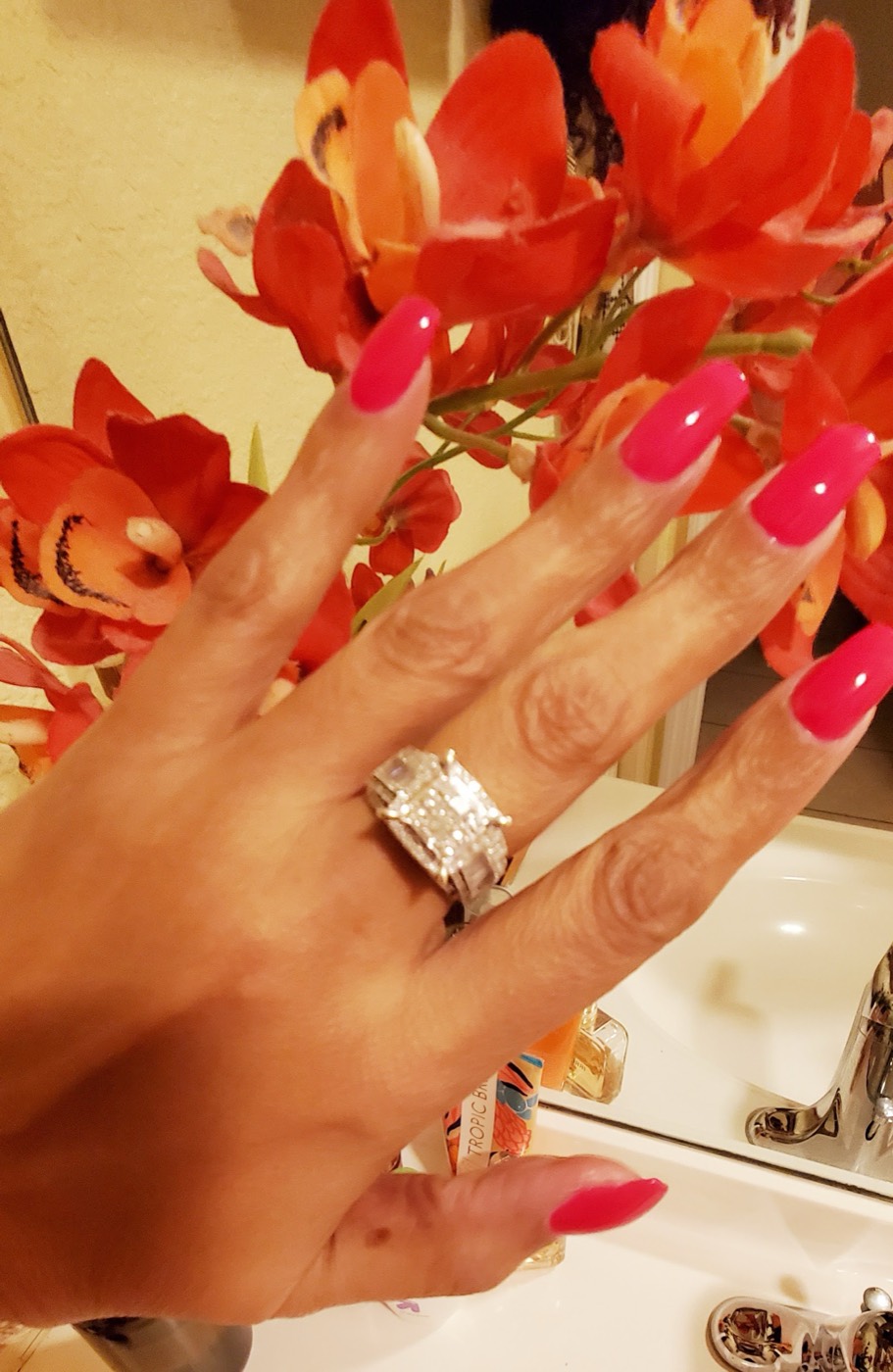 Long coffin nails in glossy hot pink
